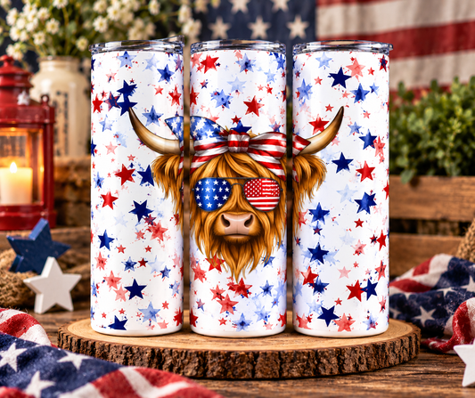 Patriotic Highland cow skinny tumbler featuring red white and blue stars and stripes design