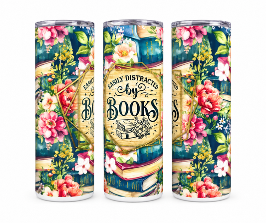 Easily Distracted by Books 20oz skinny tumbler with colorful floral and vintage book design.
